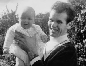 Kim as a baby with Dad